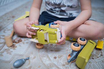 Child with autism playing with cars. Autism concept
