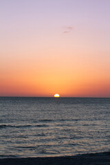 Sunsets Over Beaches, Palm Trees and Oceans