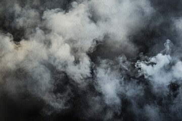 Fototapeta premium Dense, swirling smoke fills the dark background.