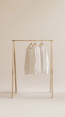 Minimalist Apparel Display Three White Shirts on Wooden Rack on Beige Background