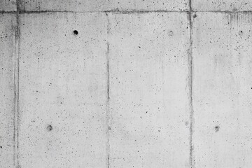 Gray concrete wall texture with recessed panels.