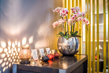 Elegant Floral Display on Modern Wooden Table With Warm Lighting Ambiance