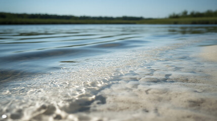 Clear water laps sandy beach, summer sun