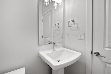 Bathroom with a white sink and toilet