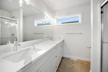 Bathroom with a white sink and a white toilet