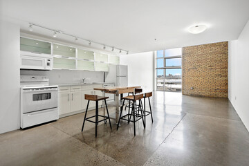 Kitchen with a white stove and a refrigerator