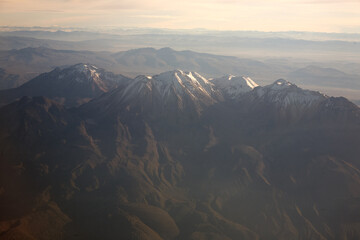Towering over Arequipa, the snow-dusted slopes of Chachani stand guard like an ancient sentinel. At...
