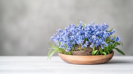 Delicate spring flowers in a nest-shaped arrangement