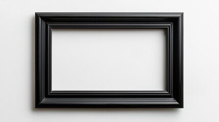 A mockup of an empty black frame on the wall, leaning against a white background with plants and shadows
