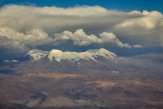 From above, the glaciated crown of Coropuna dominates the high-altitude desert&mdash;Peru's tallest volcano, its icy slopes shimmering under the Andean sun