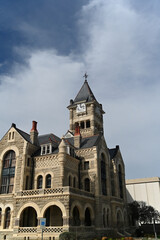 Historic Stone Courthouse Under Blue Sky