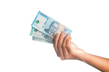 Hand Holding Indonesian Rupiah IDR 50000 Banknotes Isolated on White Background.Hand Holding Indonesian Rupiah IDR 50000 Banknotes Isolated on White Background.