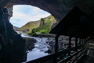 Smoo Cave in the Scottish Highlands captivates with its wide coastal opening and water-carved...
