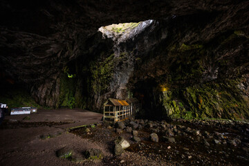 Smoo Cave in the Scottish Highlands captivates with its wide coastal opening and water-carved...