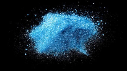 Vibrant blue powder explosion against a black background.