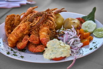 Peruvian Camarones Fritos, or fried shrimp, is a delicious and popular dish that features crispy and flavorful shrimp. Peruvian cuisine is known for its vibrant and diverse flavors.