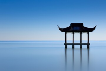 Serene pavilion over water coastal landscape photography tranquil environment wide angle peaceful retreat