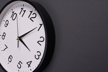 Close-up of a wall clock. The concept of time and work time is valuable for life, Alarm clock stopped. photo in a coloured background