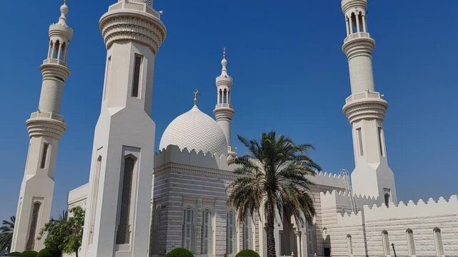Beautiful Landscape mosque, Islamic background Mosque, Minaret of Mosque, Masjid design in Islamic religious architectural traditions. Sheikh Zayed Grand Mosque: AJMAN, UNITED ARAB EMIRATES.