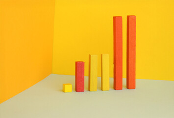 Colorful bar graph with arrow pointing upwards. Business, market growth and progress concept.