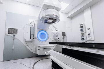 A radiation therapy machine is located in a state-of-the-art medical facility, ready for use in...
