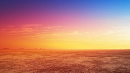 Obraz premium A breathtaking desert sky with a gradient of colors at sunset, contrasting with the barren land below.