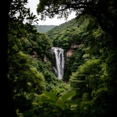 Impressive Waterfall Plunging Through Lush Green Mountain Terrain Landscape Beauty Scenery Ambience.