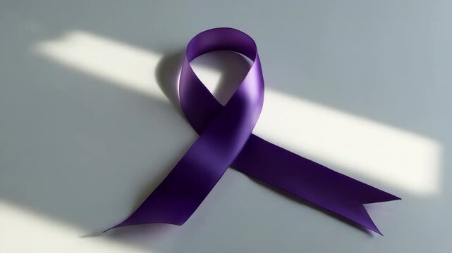 Purple Awareness Ribbon on a white background with blank area for text.