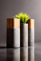 Stylish modern vases with faux greenery on a sleek surface