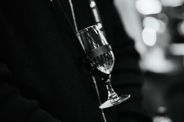 Elegant glass held casually during a night of social gatherings and conversation
