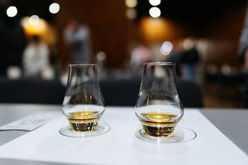 Savoring the aromas of fine spirits at a tasting event in the evening