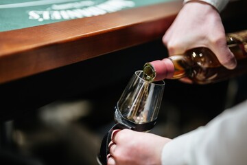 Pouring fine wine at an elegant gathering for an unforgettable evening