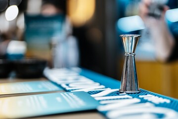 Crafting cocktails with precision at a vibrant bar in a bustling city