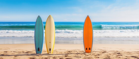 Surfboards standing on a sandy beach against a serene blue ocean backdrop. copy space for text. Vacation concept with space for text. Travel concept, Summertime concept with copy space.