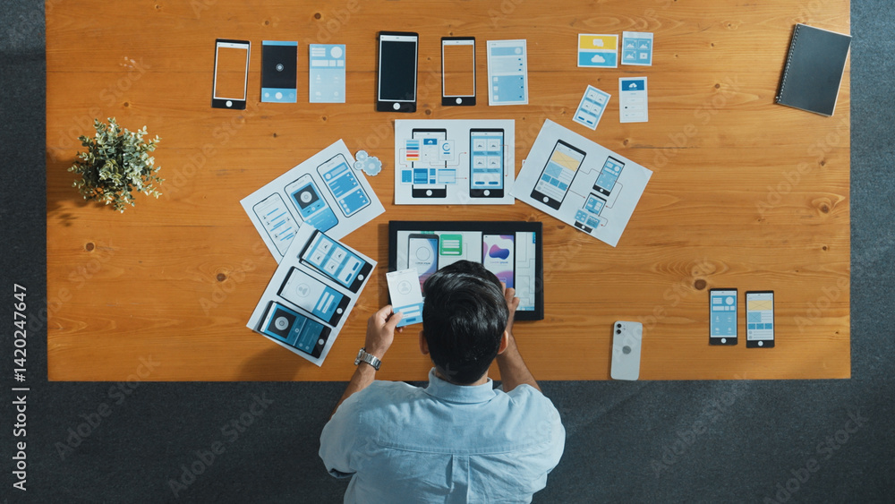 Poster top view of skilled developer walking and placing ux ui software. smart business man put tablet on m