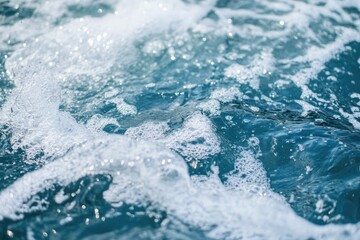 Close-up of ocean water with white foam and bubbles