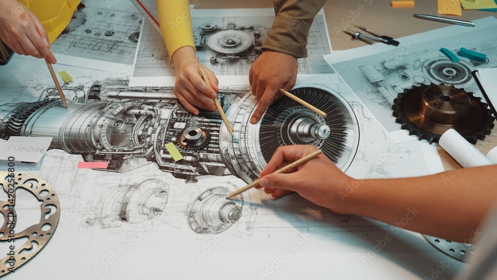 Poster engaged hands of a diverse team discussing and analyzing detailed technical drawings of turbine engi
