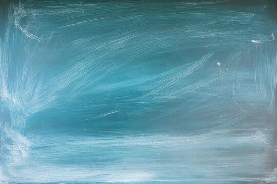 Teal chalkboard surface with white chalk streaks