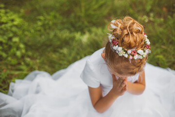 First Holy Communion girl’s hairstyle symbolizing innocence faith and Christian sacrament...