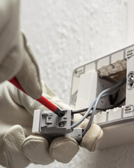 Electrician at work on a residential electrical system. Electricity.