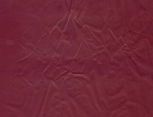 Surface of burgundy color with traces of denting. The wall of brown shade. Shabby surface of...