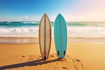 Surfboards standing on a sandy beach against a serene blue ocean backdrop. copy space for text. Vacation concept with space for text. Travel concept, Summertime concept with copy space.