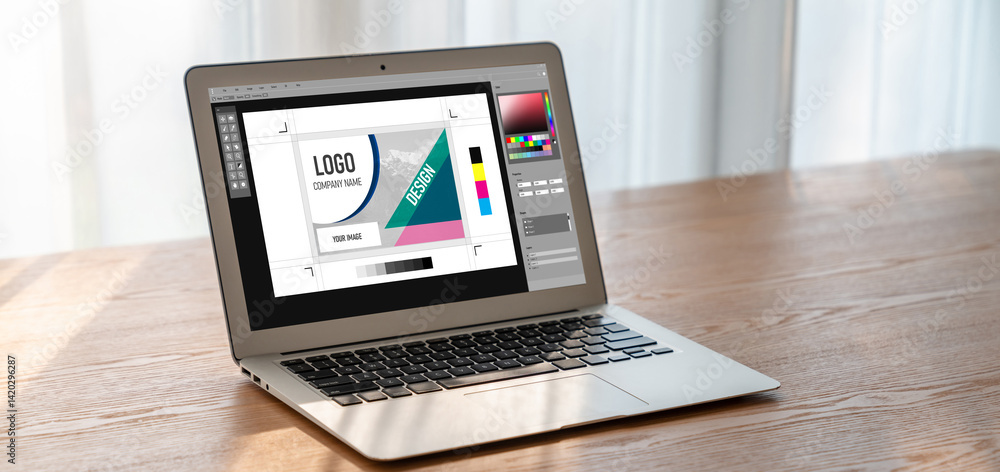 Poster graphic designer software for modern design of web page and commercial ads showing on the computer s