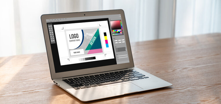 Graphic designer software for modern design of web page and commercial ads showing on the computer screen
