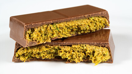 Trend Dubai Chocolate Bar with Green Kadayif Pistachio Paste and Peanut Butter on White Background