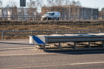 highway barrier with traffic safety markings.