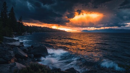 Dramatic sunset over a lake with stormy clouds.