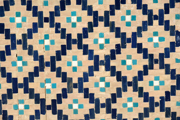 brick wall with blue ceramic tiles