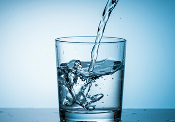 Refreshing Water Pouring into a Glass