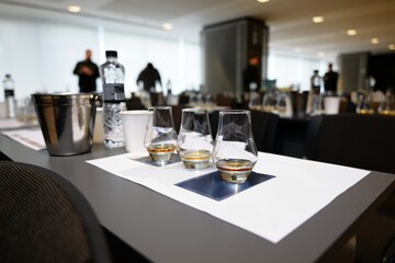 Whiskey tasting event showcasing elegant glasses and social atmosphere